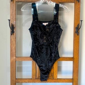 Women’s Luxxel black velvet bodysuit. Worn only once, no snags or holes.